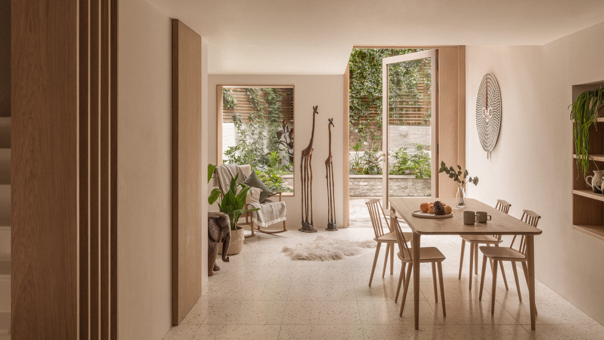 Warm-toned home extension with dining area