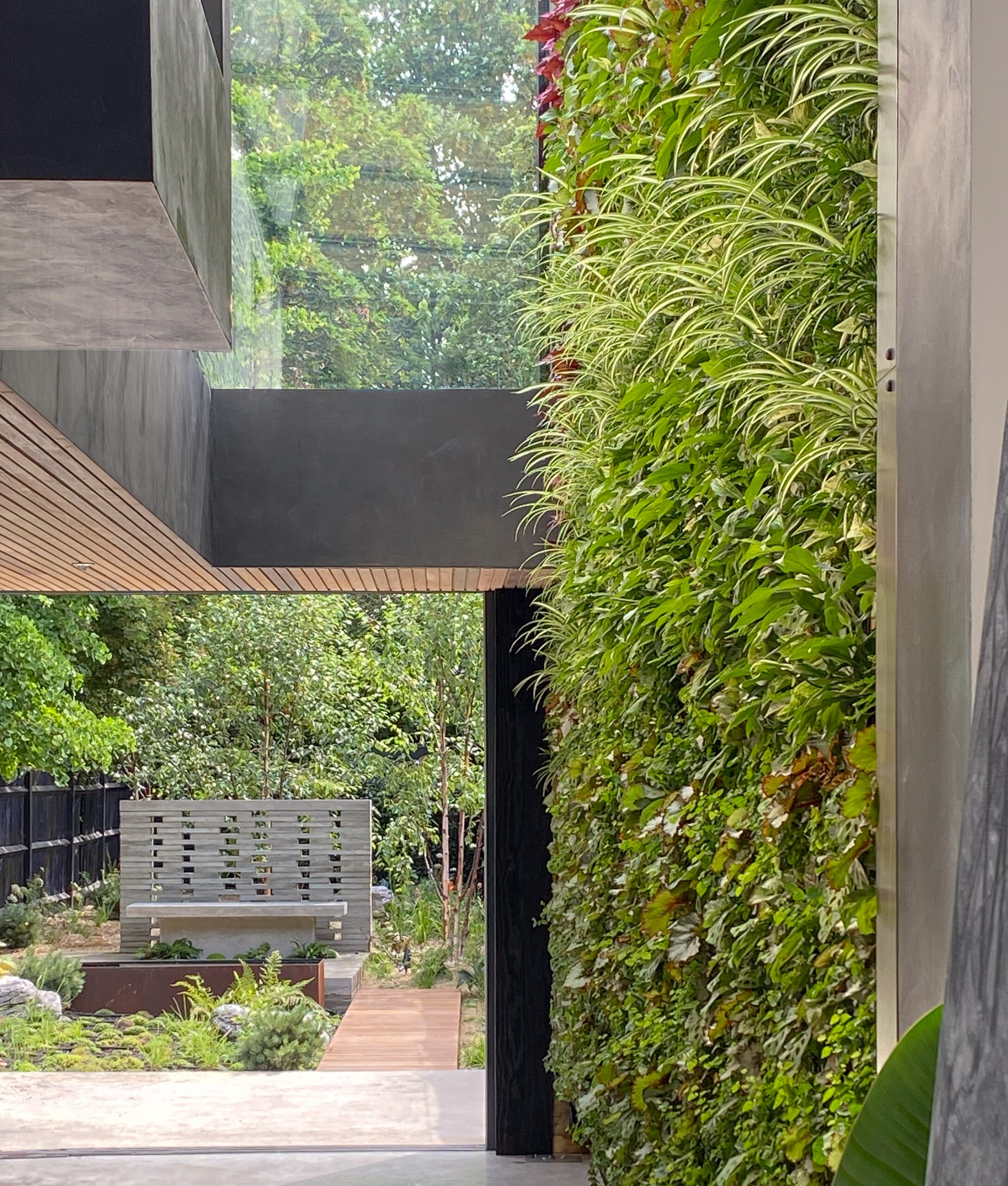 Exterior of a home featuring a green wall